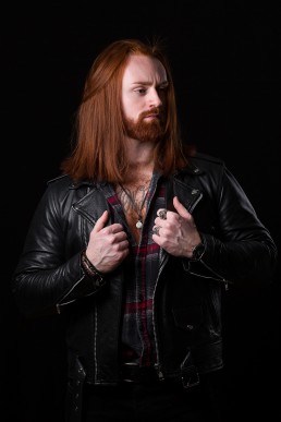 Actor headshot, red hair, ginger male, holding leather jacket