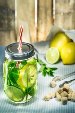 Food photography of mint drink with lemons and limes